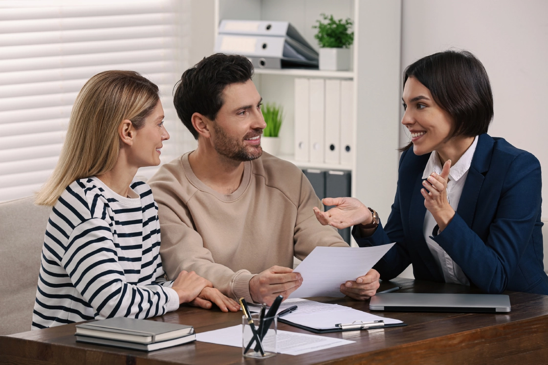 Couple consulting with a professional advisor.