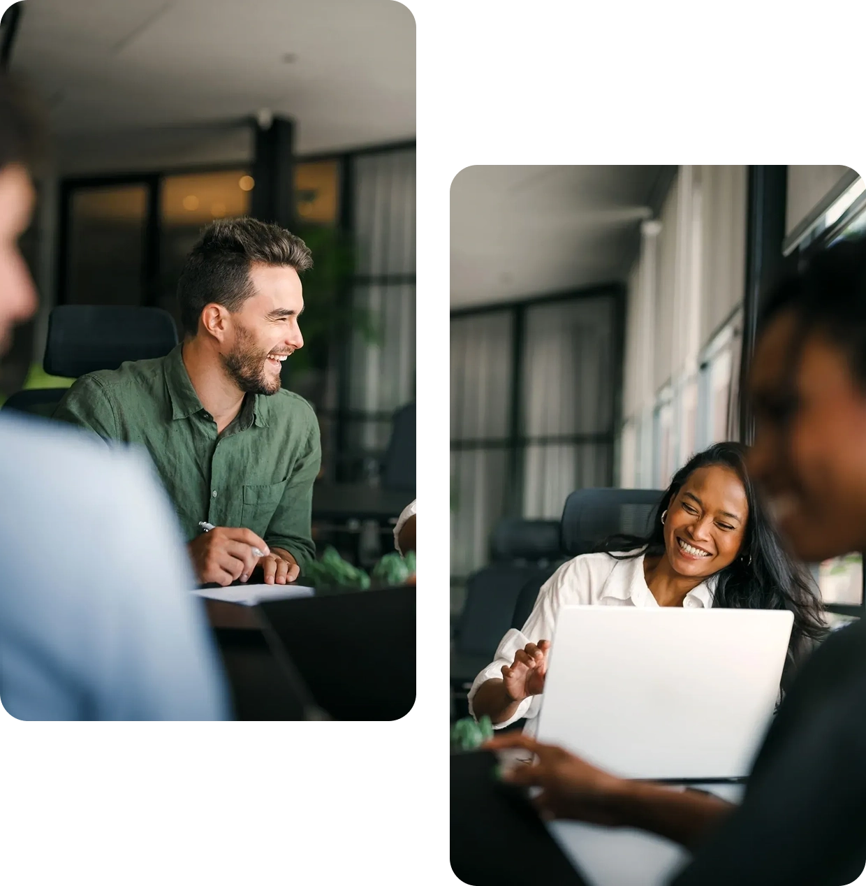 People smiling and collaborating in office setting.